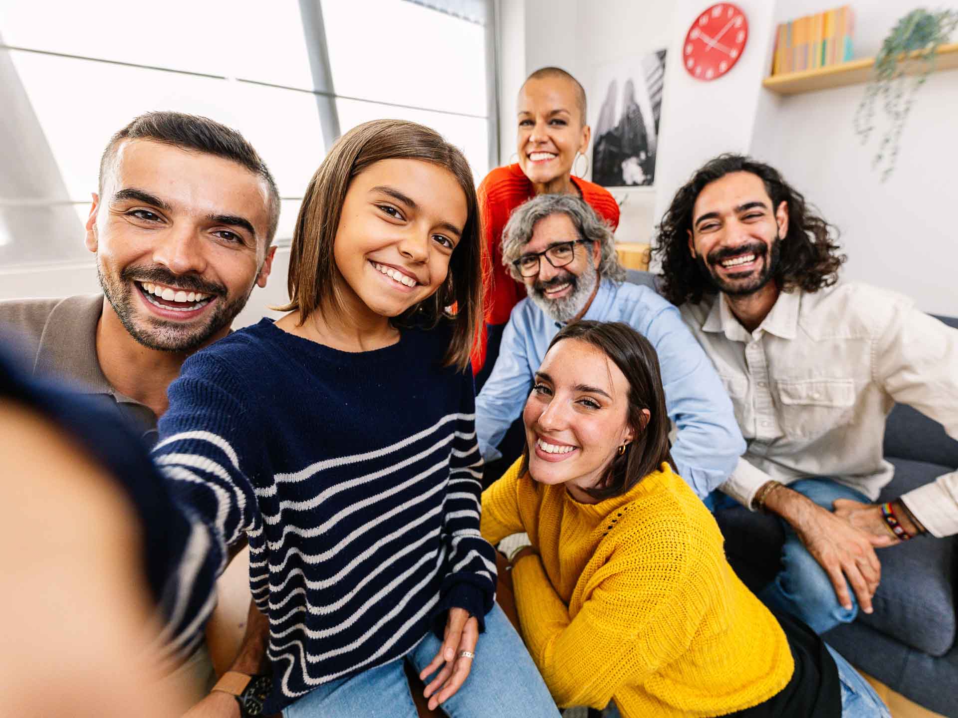 Multigenerational family smiling together representing family dental care at Grand Blanc Dental Center in Grand Blanc Michigan
