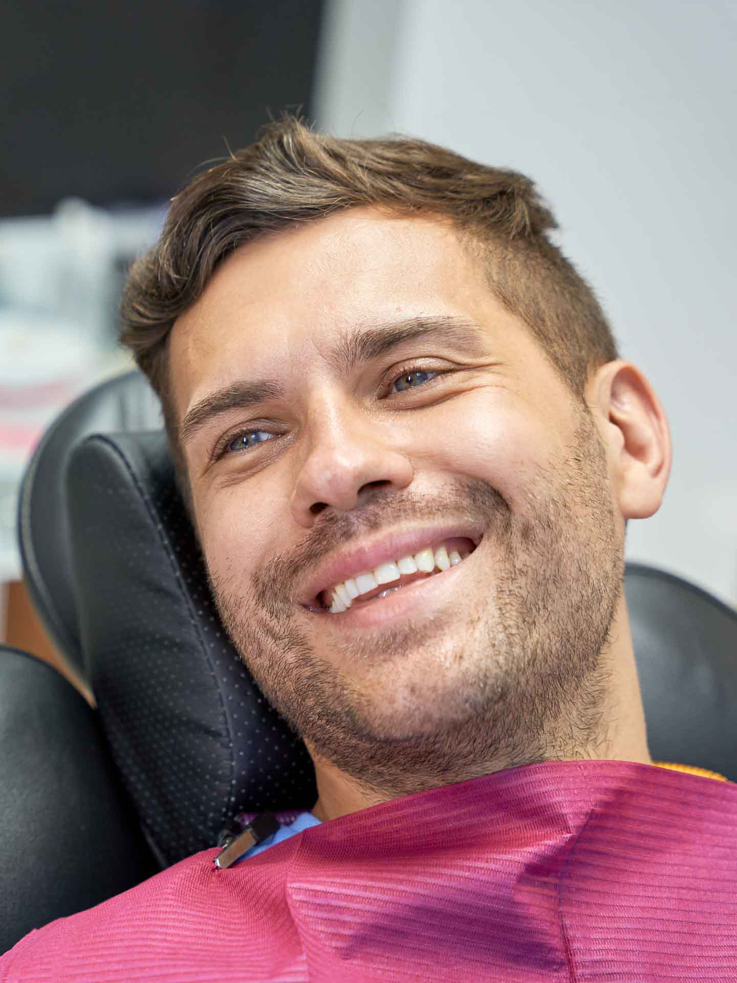 Patient smiling during a restorative dentistry visit in Grand Blanc, Michigan